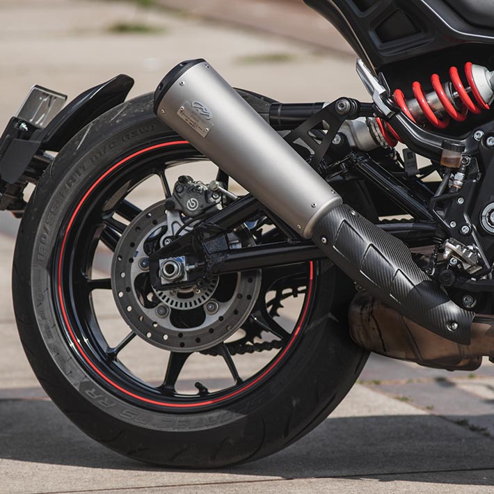 Closeup of the Indian FTR lower exhaust in Pearl Grey with the streetfighter end cap in black.